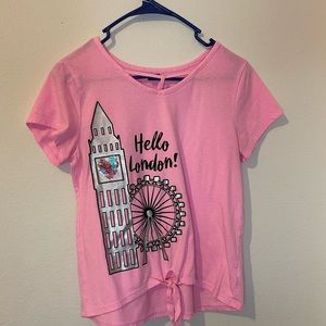 Justice’s pink shirt